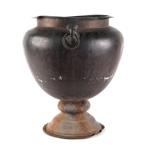 445 - An Indian copper jardinière with mythical beast mask handles, 42cm diameter.