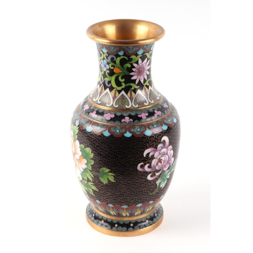 446 - A Chinese cloisonné vase decorated with peonies, 23cms high.