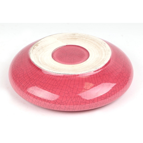 451 - A Chinese pink glazed crackle ware brush washer, with a hardwood stand, 16cm diameter.