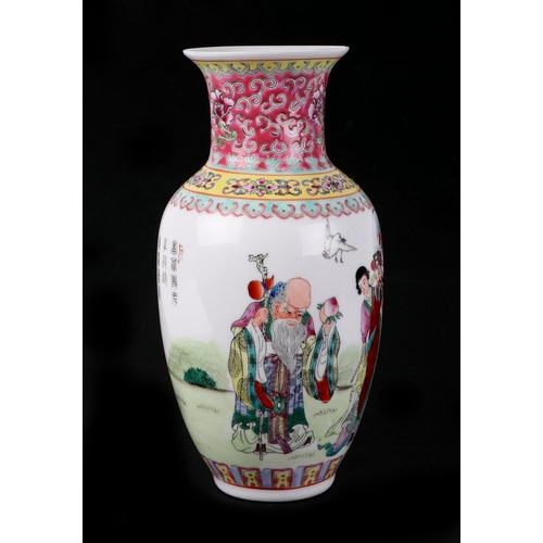 452 - A Chinese Republic style famille rose vase decorated with figures and calligraphy, 28cm high.