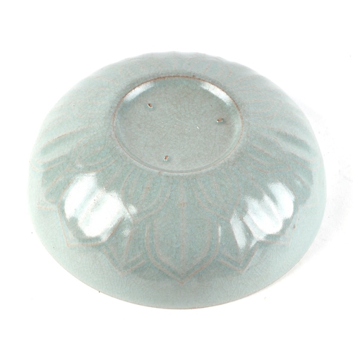 458 - A Chinese crackleware celadon glaze lotus flower bowl, 15cms diameter.