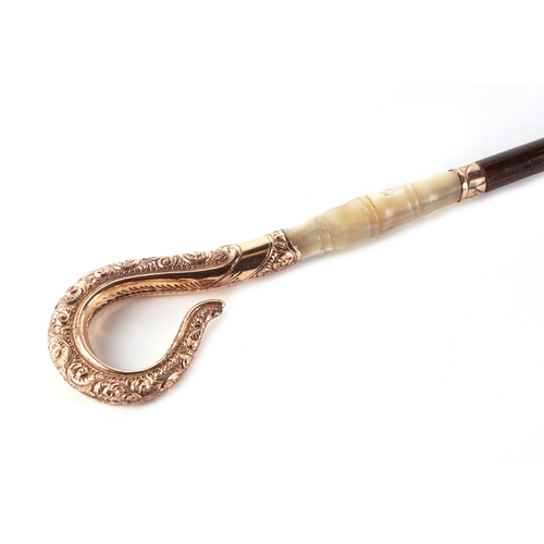 46 - A partridge wood swordstick with ornate shepherds crook style gold plated and mother of pearl handle... 