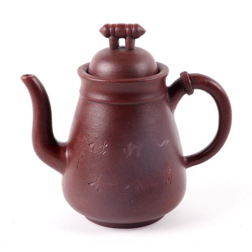 468 - A Chinese Yixing pottery teapot decorated with bamboo, four character mark to the underside, 16cm hi... 