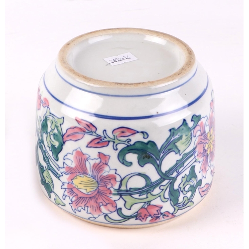 471 - A Chinese famille rose bowl and pierced cover decorated with scrolling flowers, 15cms high.