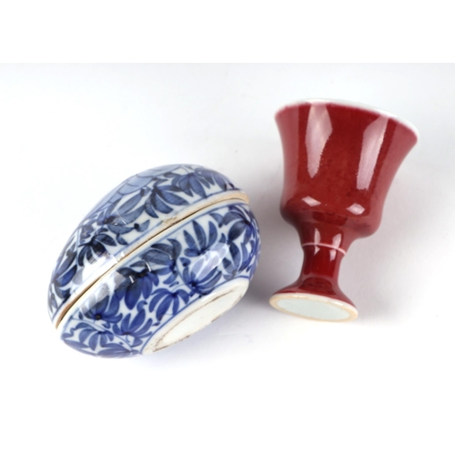 474 - A Chinese monochrome stem cup, 6cms high; together with a Chinese egg form blue & white box and cove... 