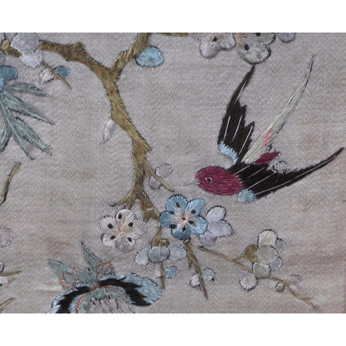 483 - A pair of 19th century Chinese silk embroidered panels decorated with birds and butterflies amongst ... 