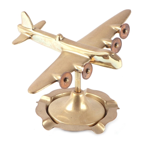 50 - A trench art cast brass model of a Sterling Bomber, on a brass ashtray, wingspan 19cm.