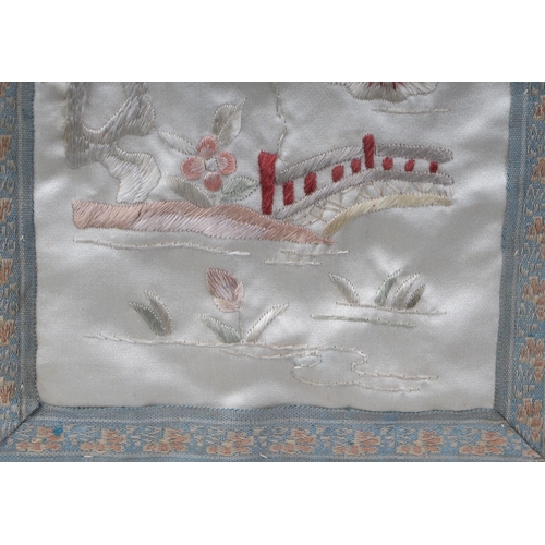 521 - A Chinese silk embroidered panel depicting cranes and other birds, 49 by 68cms, framed; together wit... 