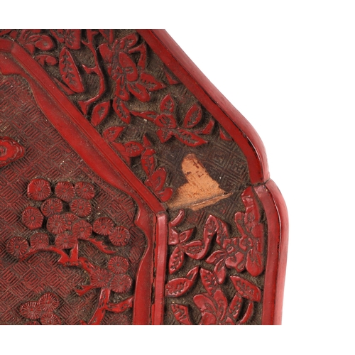 532 - A Chinese cinnabar lacquer octagonal dish decorated with a figure and tiger in a landscape, 30cms wi... 