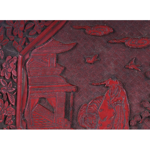 532 - A Chinese cinnabar lacquer octagonal dish decorated with a figure and tiger in a landscape, 30cms wi... 