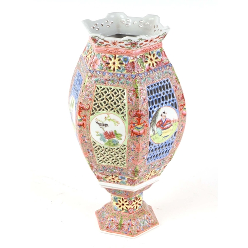 545 - A Chinese reticulated famille rose lantern of hexagonal form decorated with figures and birds within... 