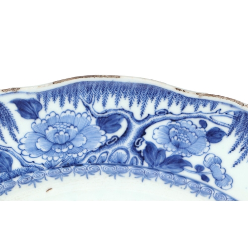 552 - A Chinese blue & white charger decorated with bamboo and flowers, 42cms diameter.