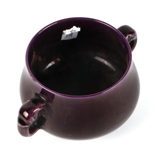 555 - A Chinese aubergine glaze two-handled censer on a hardwood stand, 6cms high, a mottled glazed brush ... 