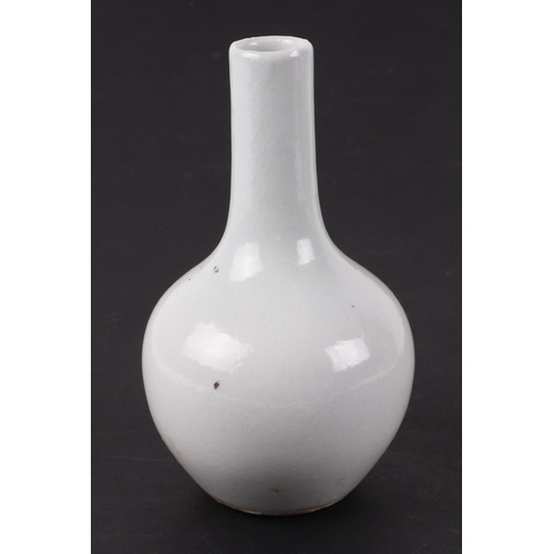 556 - A Chinese yellow monochrome bottle vase on stand, 17cms high; together with a Chinese white glazed m... 