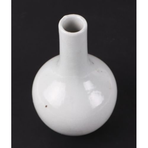 556 - A Chinese yellow monochrome bottle vase on stand, 17cms high; together with a Chinese white glazed m... 