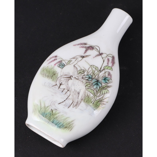 558 - A group of Chinese porcelain and reverse painted glass snuff bottles, the largest 8cms high (6).