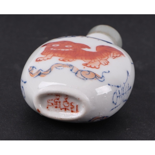 558 - A group of Chinese porcelain and reverse painted glass snuff bottles, the largest 8cms high (6).