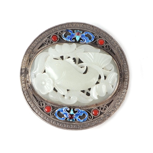 559 - A Chinese white metal and enamel belt buckle set with an oval jade / hardstone panel depicting fish ... 