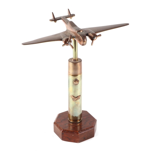 56 - A trench art cast brass model of Blenheim Light Bomber aircraft, mounted on a brass plinth, wingspan... 