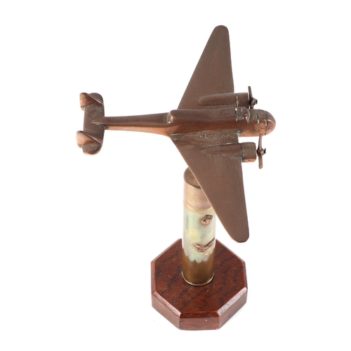 56 - A trench art cast brass model of Blenheim Light Bomber aircraft, mounted on a brass plinth, wingspan... 