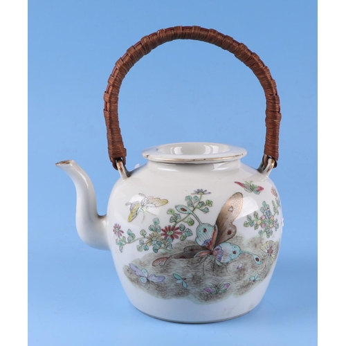 566 - A Chinese famille rose teapot decorated with butterflies, swallows and flowers, red seal mark to the... 