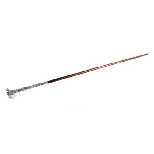 57 - A partridge wood swordstick with ornate sterling silver handle, having a square tapering steel blade... 