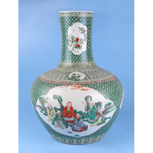 570 - A very large Chinese famille vert vase decorated with flowers within panels (drilled), 50cm high.Con... 