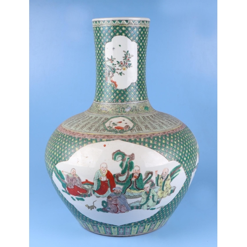 570 - A very large Chinese famille vert vase decorated with flowers within panels (drilled), 50cm high.Con... 