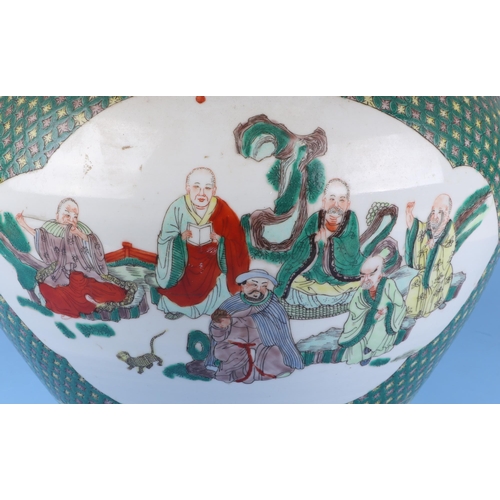 570 - A very large Chinese famille vert vase decorated with flowers within panels (drilled), 50cm high.Con... 