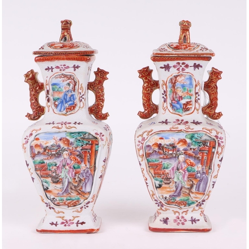 575 - A pair of Chinese Mandarin palette famille rose Export vases and covers moulded in relief with oppos... 