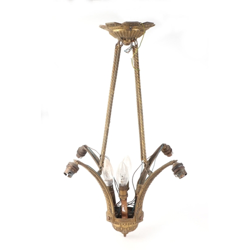 592 - An early 20th century four-branch brass ceiling light, approx 53cms high.