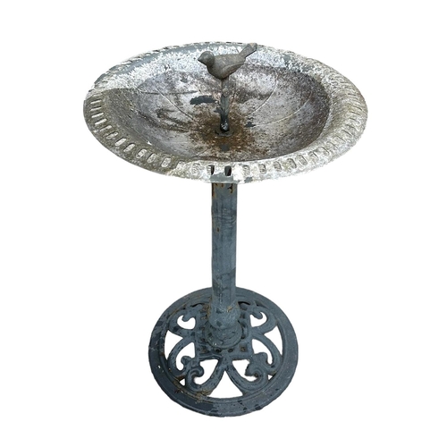 6 - A metal bird bath on octagonal column and circular base, 48cms diameter.