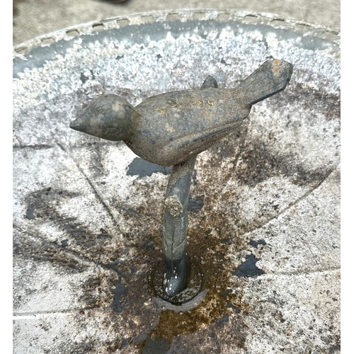 6 - A metal bird bath on octagonal column and circular base, 48cms diameter.