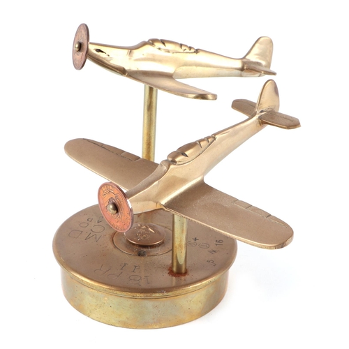 60 - A pair of trench art cast brass models of Hurricane Fighter Plane aircrafts, mounted on a brass shel... 