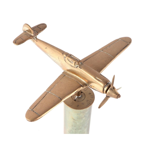 62 - A trench art cast brass model of a Messerschmitt BF110, mounted on a brass shell case, wingspan 20cm... 