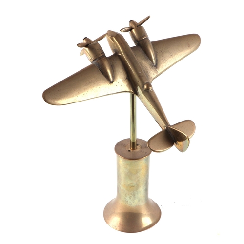 63 - A trench art cast brass model of a Sterling Bomber, mounted on a brass plinth, wingspan 23cm.