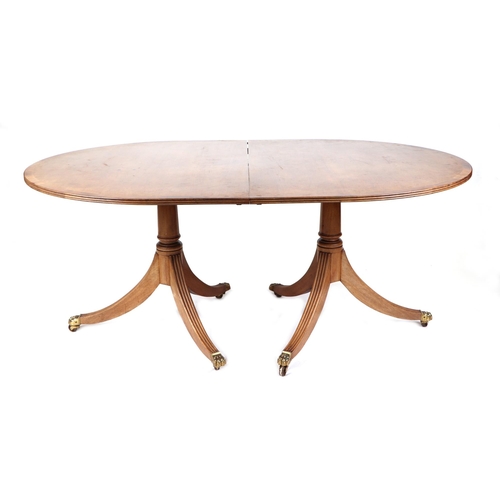 677 - A mahogany D-end twin pedestal dining table, with one extra leaf, 110 by 232cm extended.