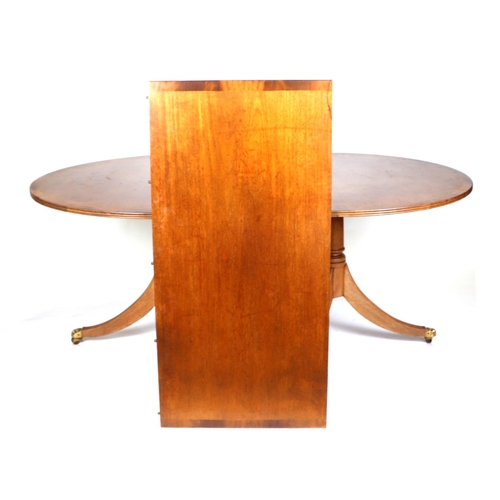 677 - A mahogany D-end twin pedestal dining table, with one extra leaf, 110 by 232cm extended.