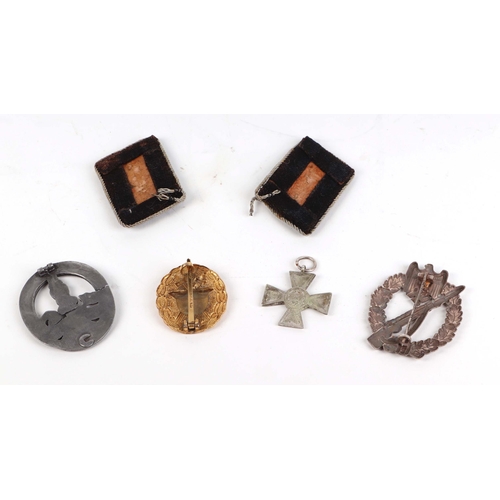 68 - A group of German Third Reich badges and other items.