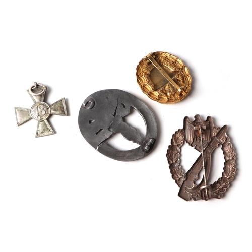 68 - A group of German Third Reich badges and other items.