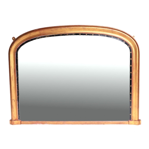 682 - A 19th century giltwood and ebonised over-mantle mirror, 109cm overall width.