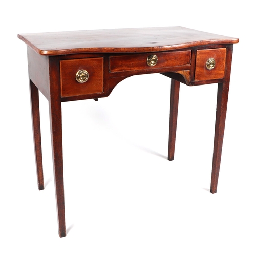 738 - A 19th century mahogany serpentine front side table, having an arrangement of three drawers on taper... 