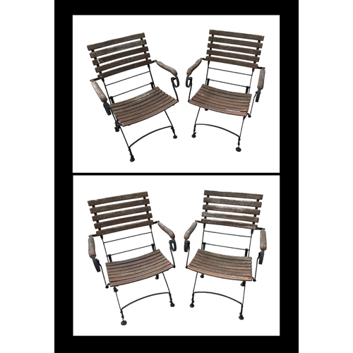 8 - A set of four folding slatted wooden and metal garden chairs (4).