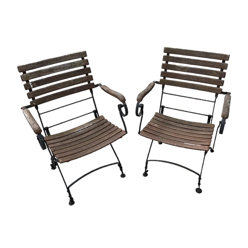 8 - A set of four folding slatted wooden and metal garden chairs (4).