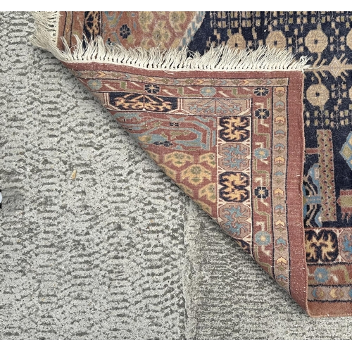 83 - A Persian hand knotted prayer rug with geometric design on a beige ground, 130 by 91cms.