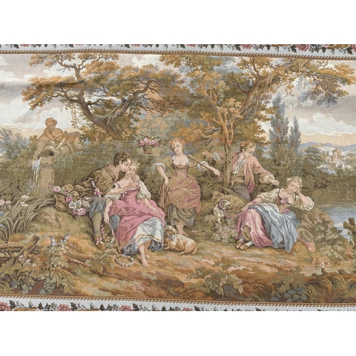 87 - A modern Aubusson style tapestry depicting a classical scene within a floral border, 177 by 95cms.