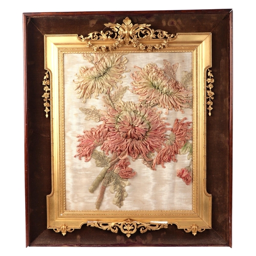 88 - An embroidered and needlework silk panel depicting chrysanthemums, 40 by 33cms, framed.