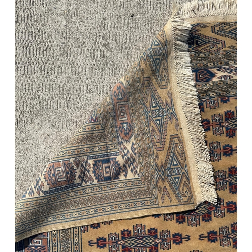 97 - A Persian silk flatweave rug with stylised repeat design within geometric borders, on a beige ground... 