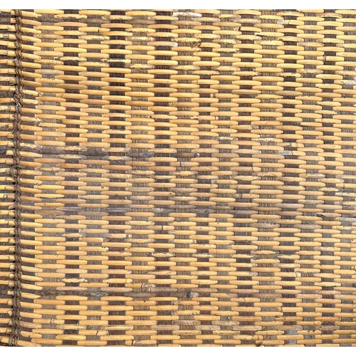 98 - An Indonesian woven rattan rug, 224cms wide.