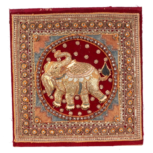 99 - A group of four Indian needlework panels, depicting elephants and mythical creatures, each approx 39... 